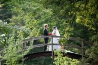 On a well-placed bridge, the bride and groom re-enact a scene from their favorite movie