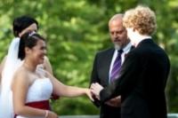 The groom places a ring on the bride's finger