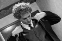 After putting on the coat, the groom is all set to go for the big day